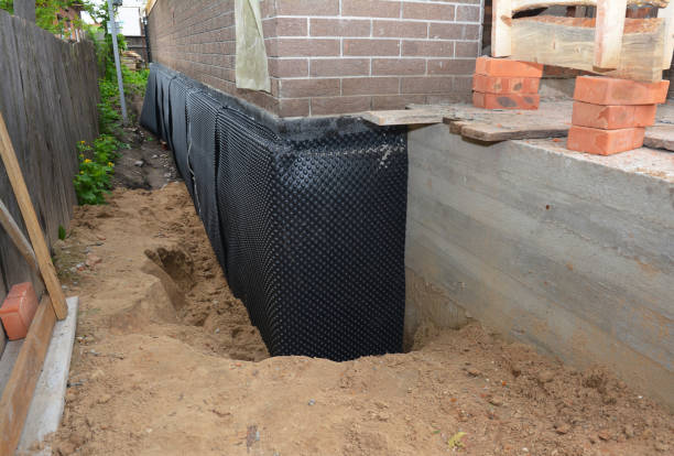 SJ Waterproofing Pros technician performing targeted Interior Drainage System assessment in Van Buren, IN